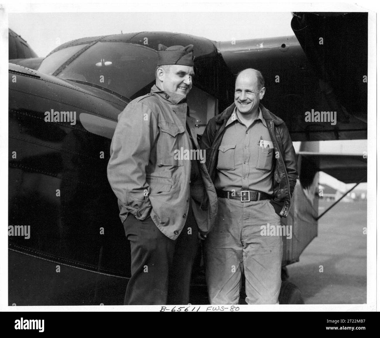This photo was taken in 1950 on Amchitka Island, Alaska. 'L-R: Captain Floyd A. Puckett, C.O. of Air Force Base on Amchitka Island and John Ball, chief of Aircraft Operations for FWS.'. Subjects: Wildlife refuges; Alaska Maritime National Wildlife Refuge; Aleutians; Aircraft; Work of Service; Personnel; ARLIS; Alaska.  . 1998 - 2011. Stock Photo