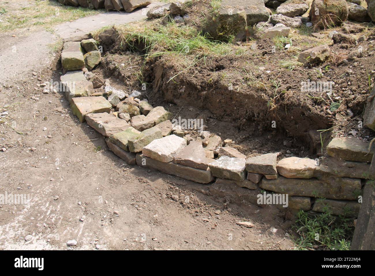 The Foundations of a Traditional Rural Dry Stone Wall Stock Photo - Alamy