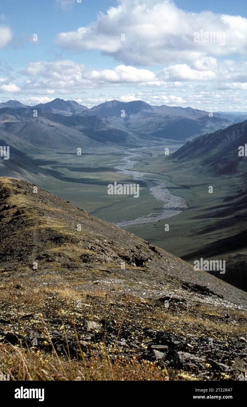 The Brooks Range river valley in Alaska offers a sweeping view of a ...