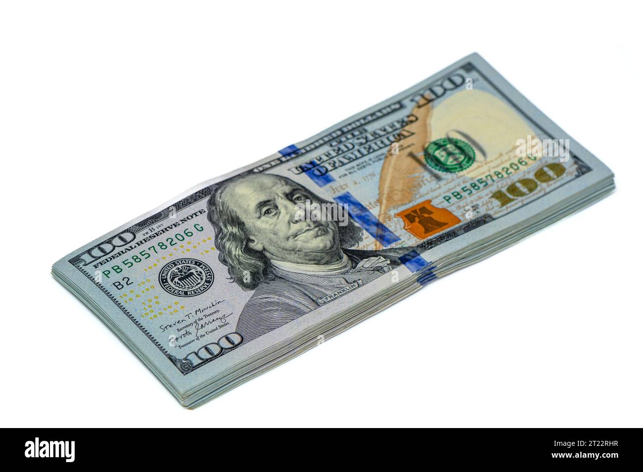 a stack of 100 dollar bills on a white background studio shooting 5 ...