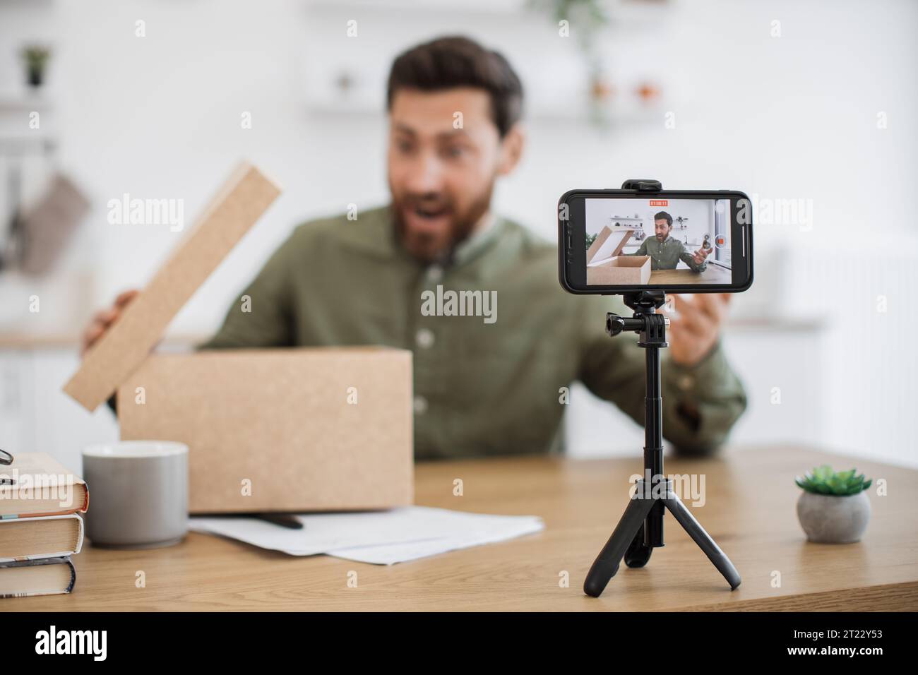 Caucasian bearded man making surprised facial expression while ...