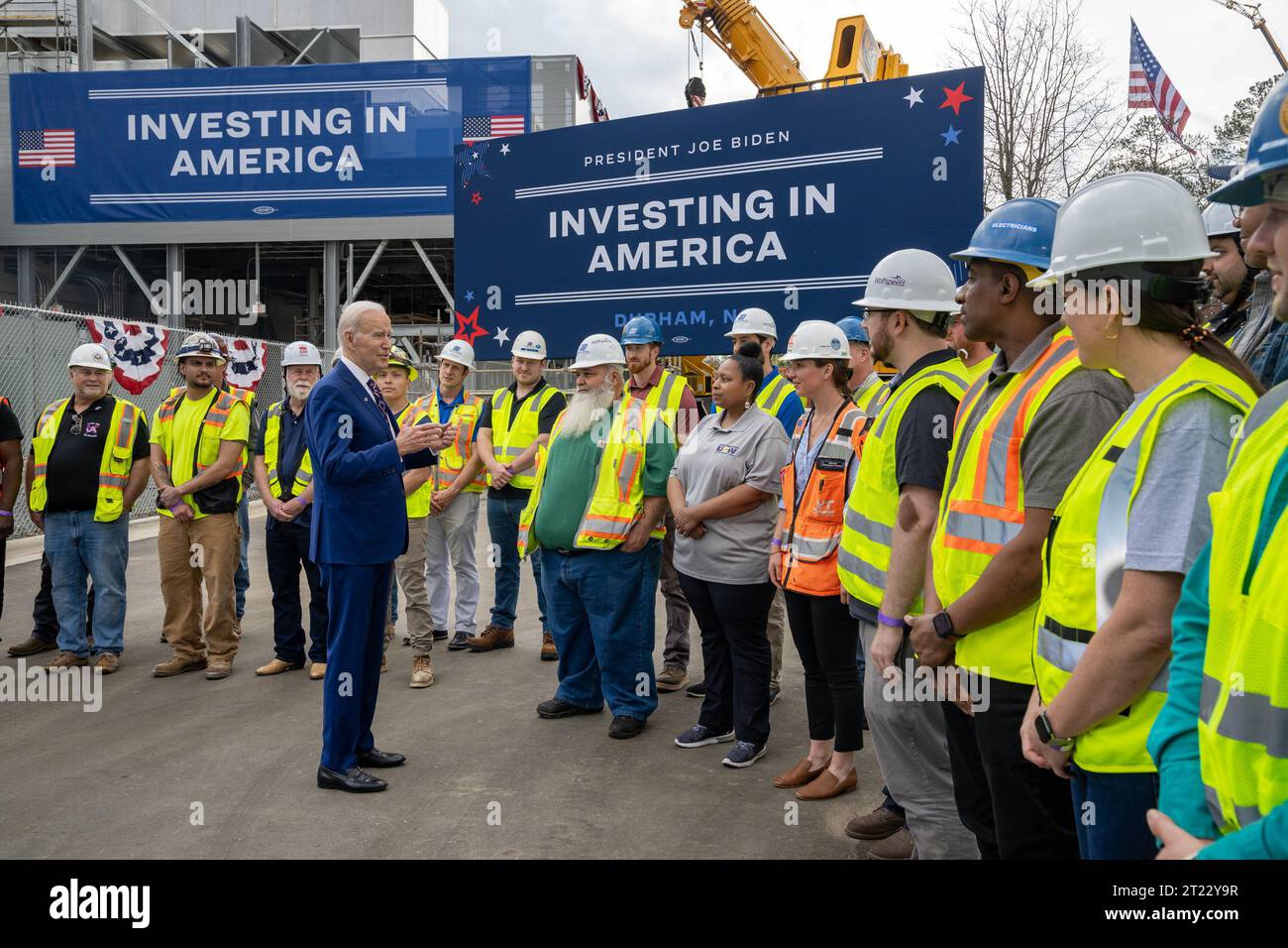President Joe Biden speaks with workers at the kickoff of his