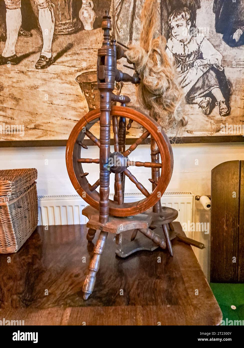 Traditional devices. Old fashioned wooden distaff, spindle, spinning