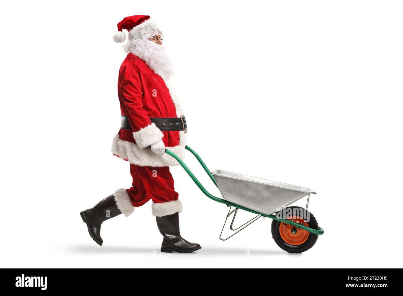 Santa Using A Walker Santa claus walking and pushing an empty wheelbarrow isolated on white ...