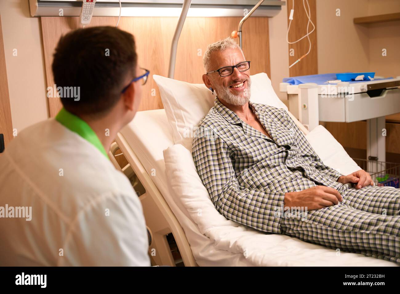 Male doctor communicates patient in hi-res stock photography and images ...