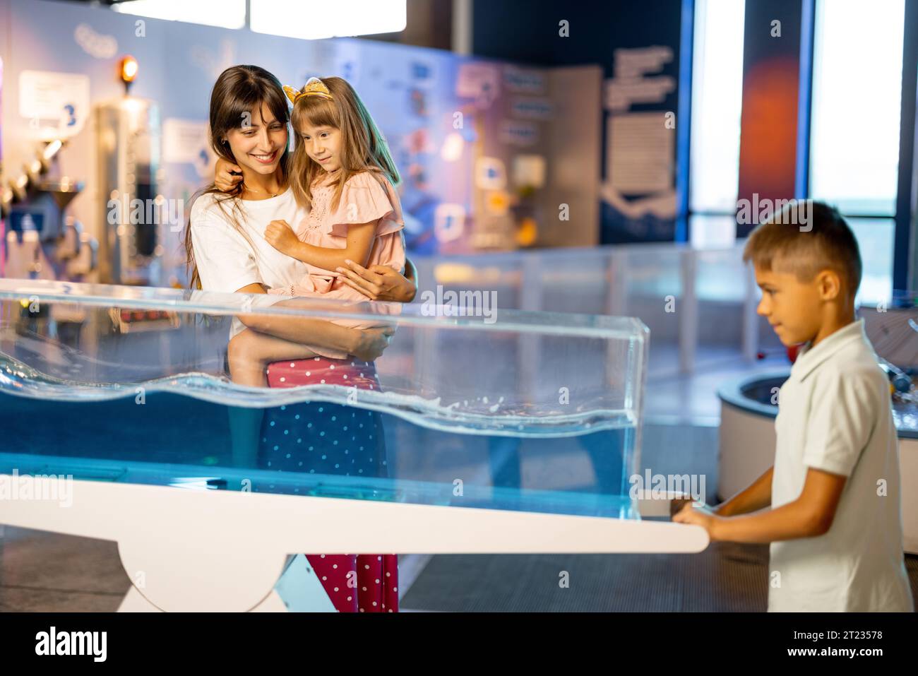 Mom with kids visit a science museum Stock Photo