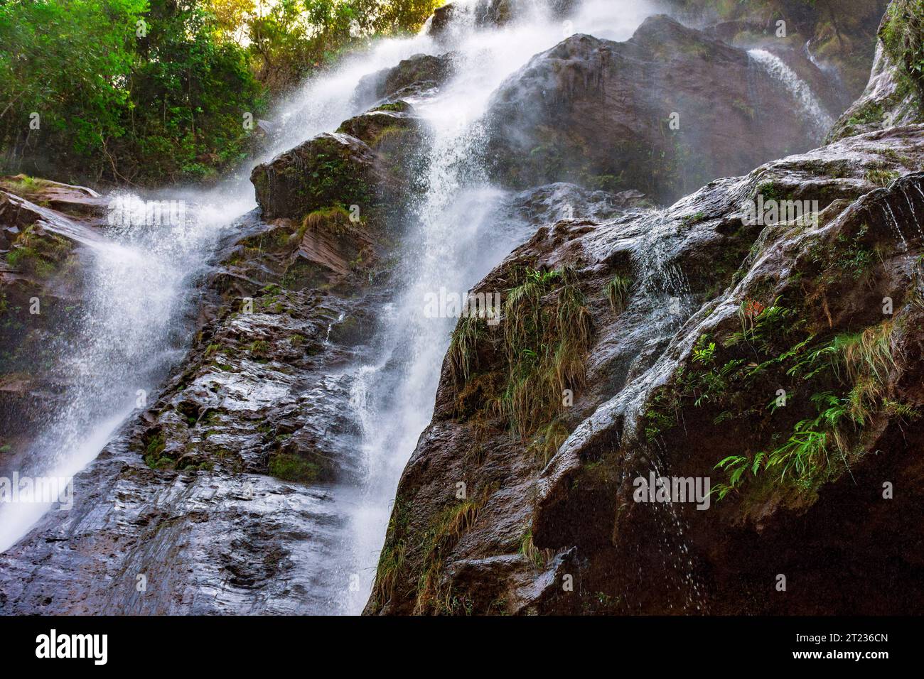 Stunning waterfal through the rocks and forest in Minas Gerais, Brazil Stock Photo