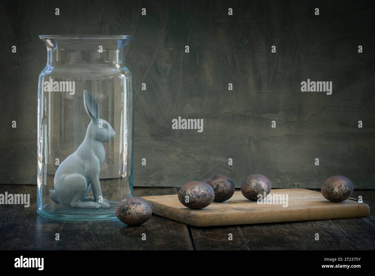 Lovely rabbits in glass container with Easter eggs .Easter animal ...