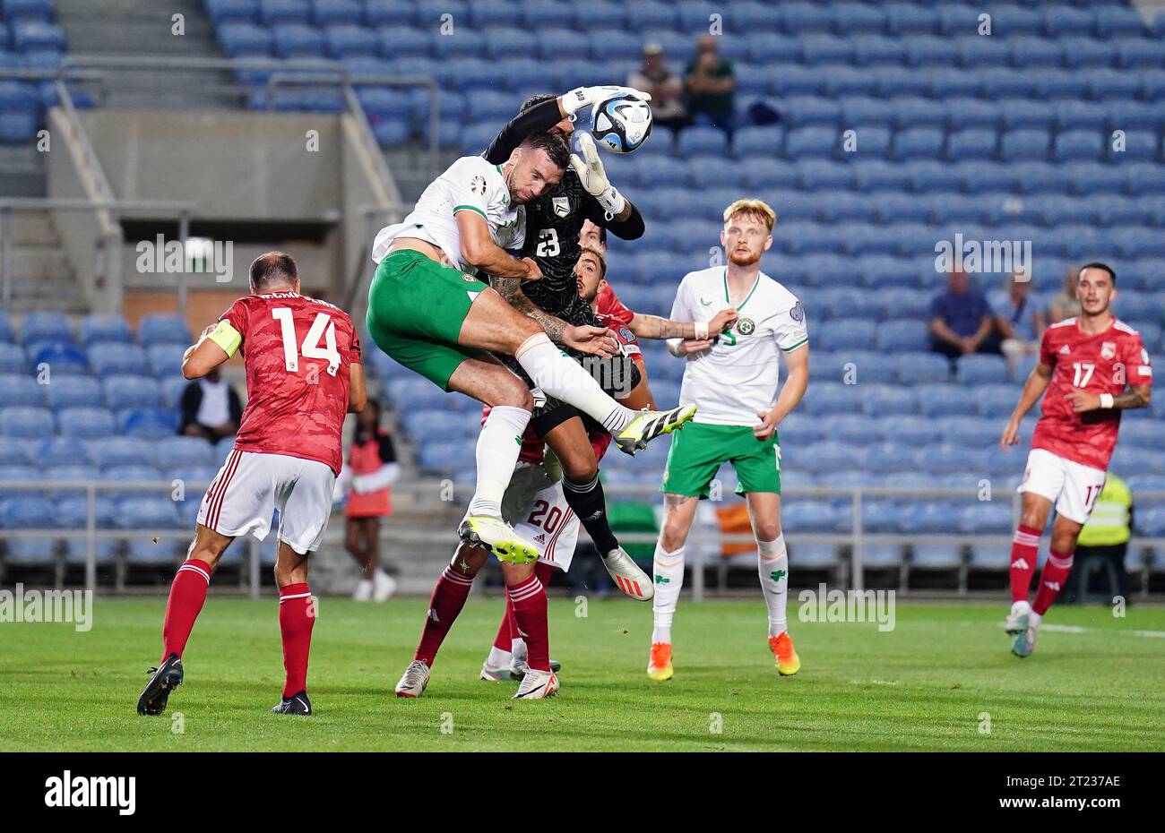 Gibraltar goalkeeper Dayle Coleing and Republic of Ireland’s Shane Duffy challenge for the ball during the UEFA Euro 2024 Qualifying Group B match at the Estadio Algarve, Almancil. Picture date: Monday October 16, 2023. Stock Photo