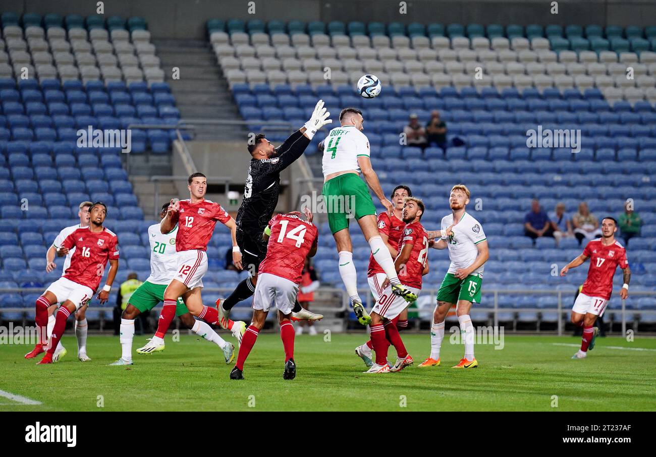 Gibraltar goalkeeper Dayle Coleing and Republic of Ireland’s Shane Duffy challenge for the ball during the UEFA Euro 2024 Qualifying Group B match at the Estadio Algarve, Almancil. Picture date: Monday October 16, 2023. Stock Photo