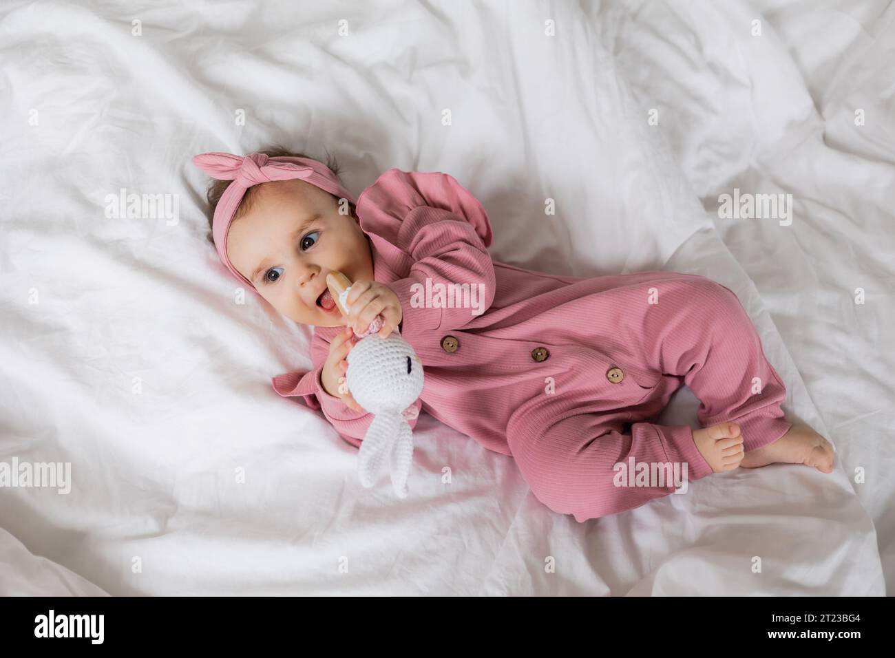 Wearing pink cap and pink pants hi-res stock photography and