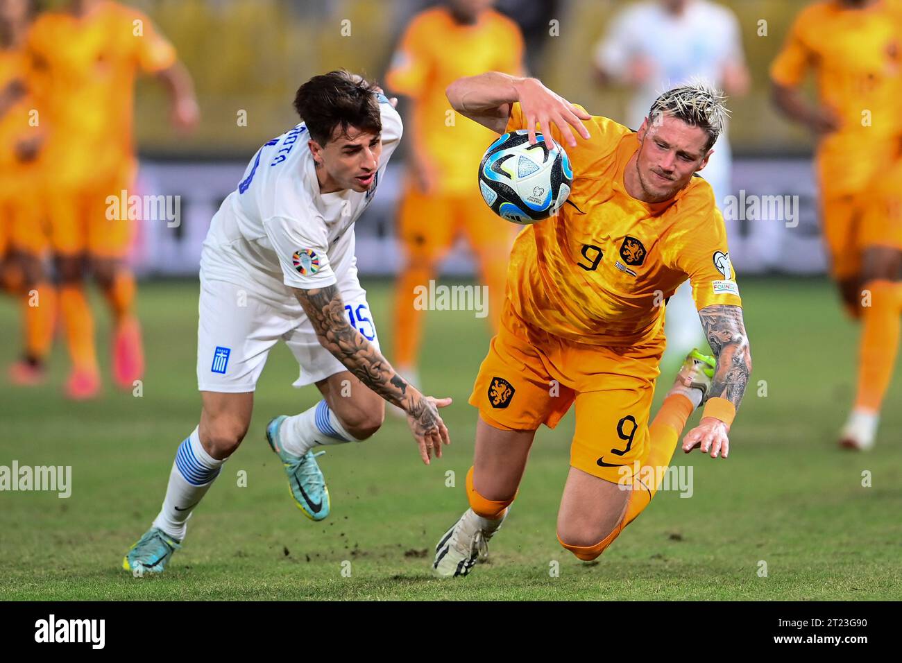 Athens, Greece. 16th Oct, 2023. ATHENS, GREECE - OCTOBER 16: Lazaros Rota of Greece battles for possession with Wout Weghorst of the Nederlands during the UEFA EURO 2024 Qualifying Round Group B match between Greece and Netherlands at OPAP Arena on October 16, 2023 in Athens, Greece (Photo by/Orange Pictures) Credit: Orange Pics BV/Alamy Live News Stock Photo