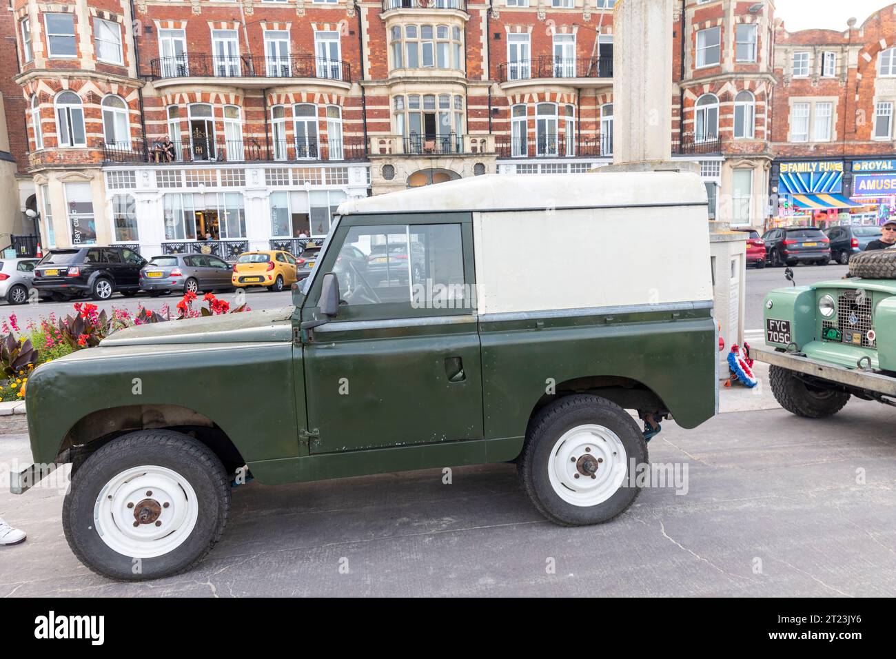 Dorset car club public event on Weymouth promenade with classic vintage Land Rover defender on display,England,UK,2023 Stock Photo