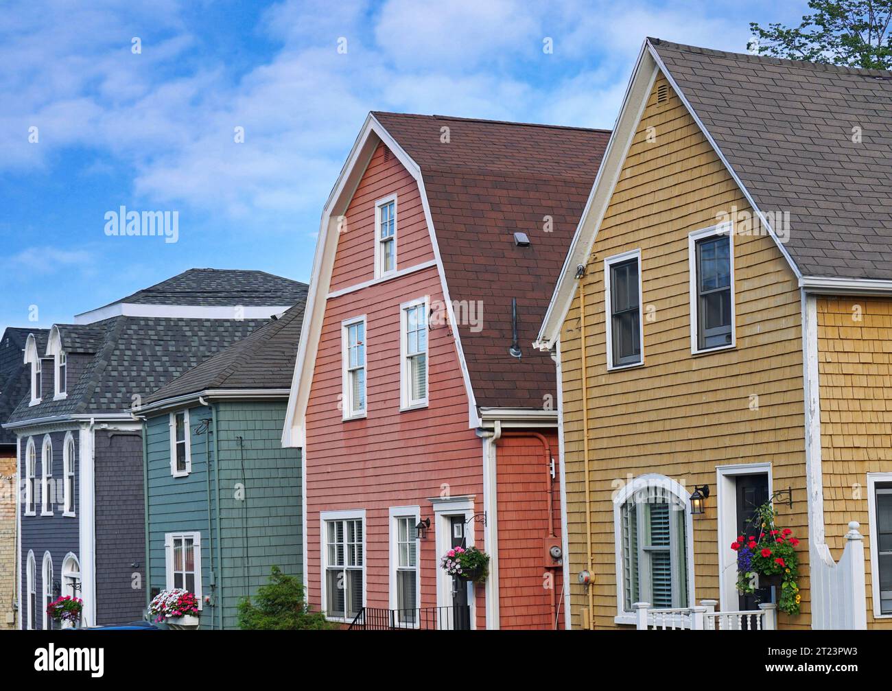 Row of colorful wooden clapboard houses Stock Photo