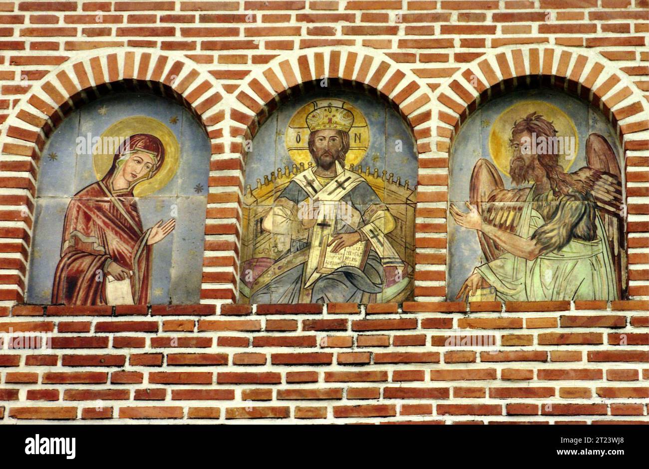Dâmbovița County, Romania, 1991. Paintings of Virgin Mary, Jesus Christ and St. John (with wings) at Dealu Monastery. Stock Photo