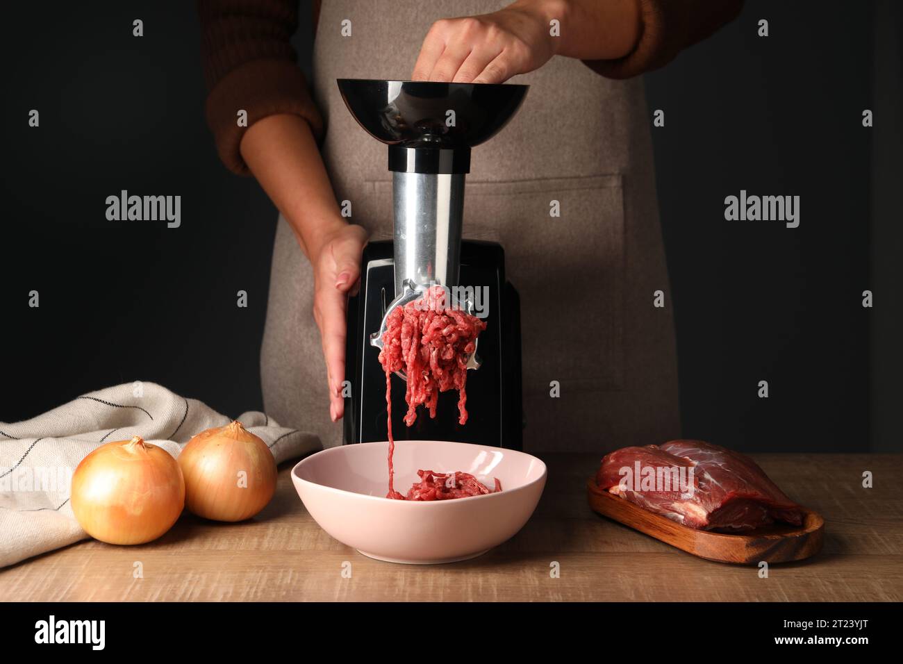 Electric meat grinder. Kitchen tool to mince meat. Meat grinding, preparing  food ingredients. Vegan Worst Nightmare Stock Photo - Alamy