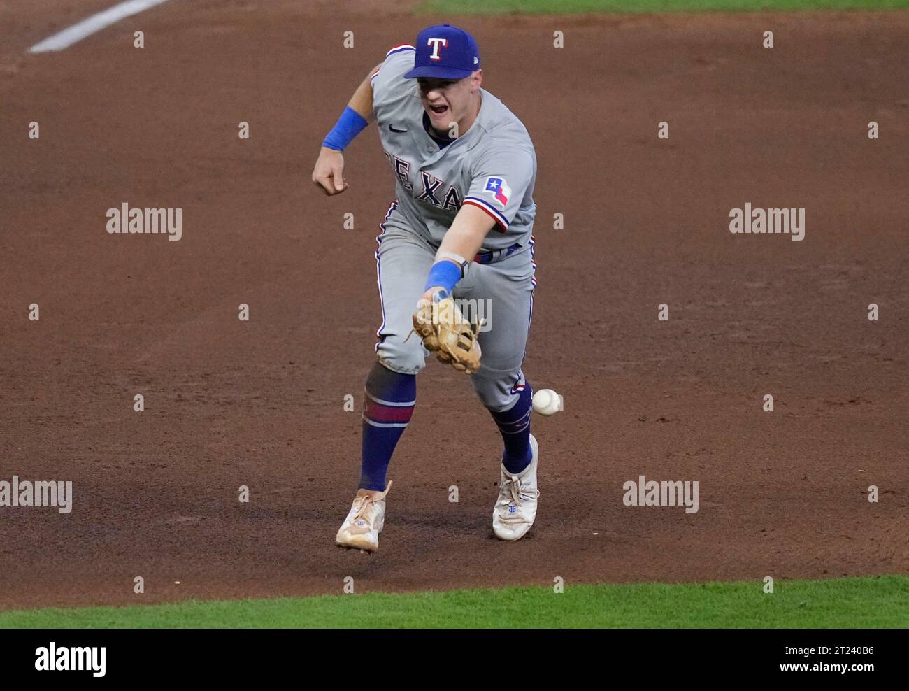 Houston, United States. 16th Oct, 2023. Texas Rangers third baseman Josh Jung commits a fielding error on a drive from Houston Astros Jeremy Pena in the fifth inning in game two of the ALCS at Minute Maid Park in Houston on Monday, October 16, 2023. Photo by Kevin M. Cox/UPI. Credit: UPI/Alamy Live News Stock Photo