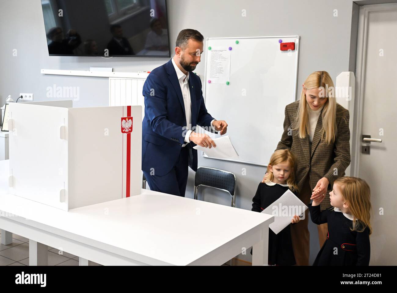 Podolany, Poland. 15th Oct, 2023. Wladyslaw Kosiniak-Kamysz (L), president of PSL and co-leader of Trzecia Droga seen at the polling station with his wife Paulina and daughters. (Photo by Alex Bona/SOPA Images/Sipa USA) Credit: Sipa USA/Alamy Live News Stock Photo