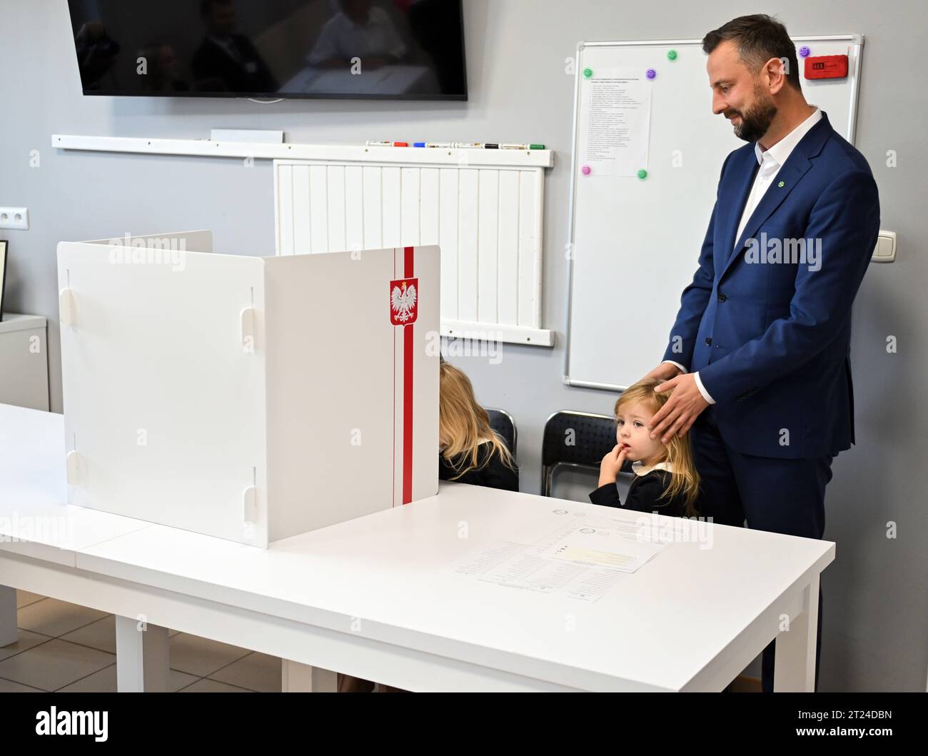 Podolany, Poland. 15th Oct, 2023. Wladyslaw Kosiniak-Kamysz (R), president of PSL and co-leader of Trzecia Droga seen at the polling station with his wife, Paulina. Credit: SOPA Images Limited/Alamy Live News Stock Photo