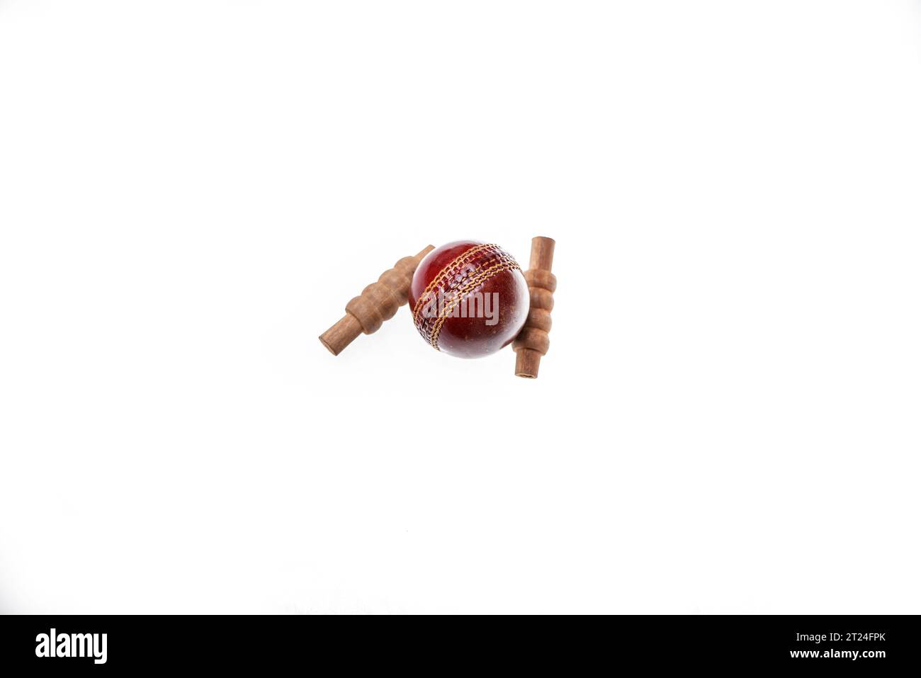 Cricket ball and bails are on isolated white background Stock Photo