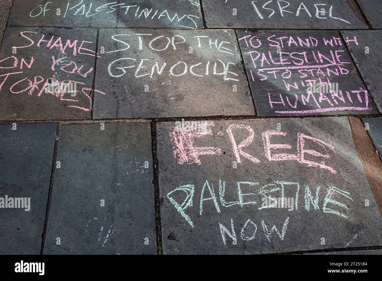 Free Palestine painted  with chalk on the street during the Pro-Palestine protest in London . Stock Photo