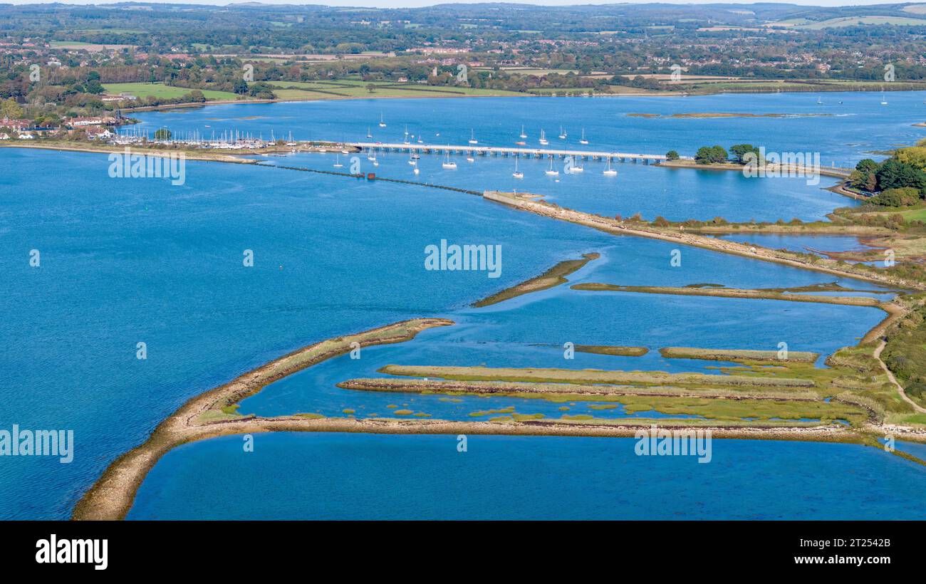 Aerial view of the Hayling Island road bridge and the remains of the Hayling Billy bridge. The renovated Oyster beds in the foreground. Stock Photo
