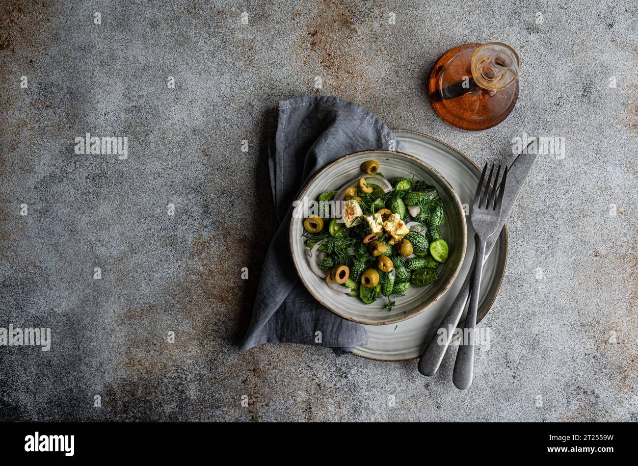 Tasty vegetable salad with cucamelon, olives and feta cheese Stock Photo