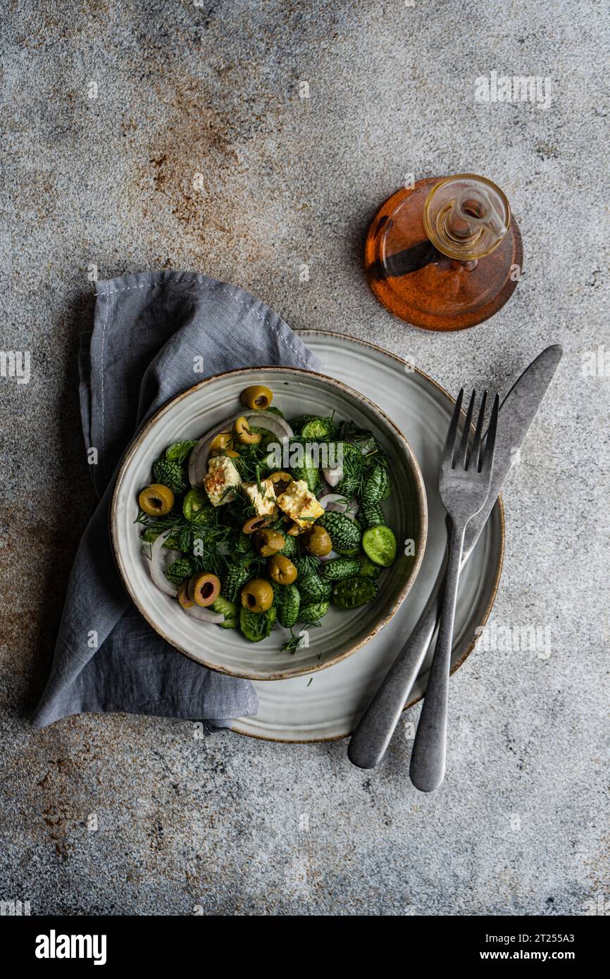 Tasty vegetable salad with cucamelon, olives and feta cheese Stock Photo