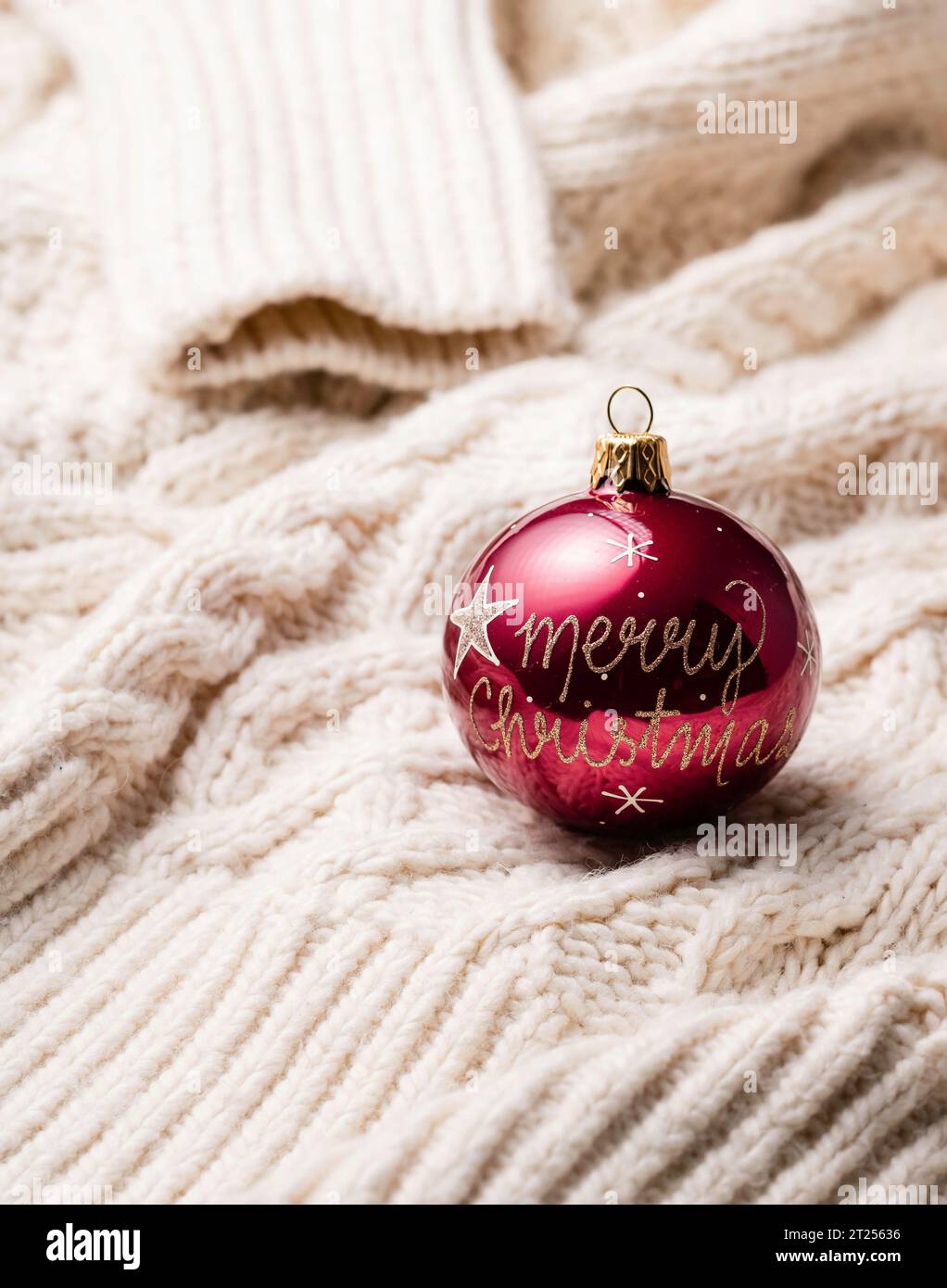Close-up of a Christmas bauble on a knitted sweater Stock Photo