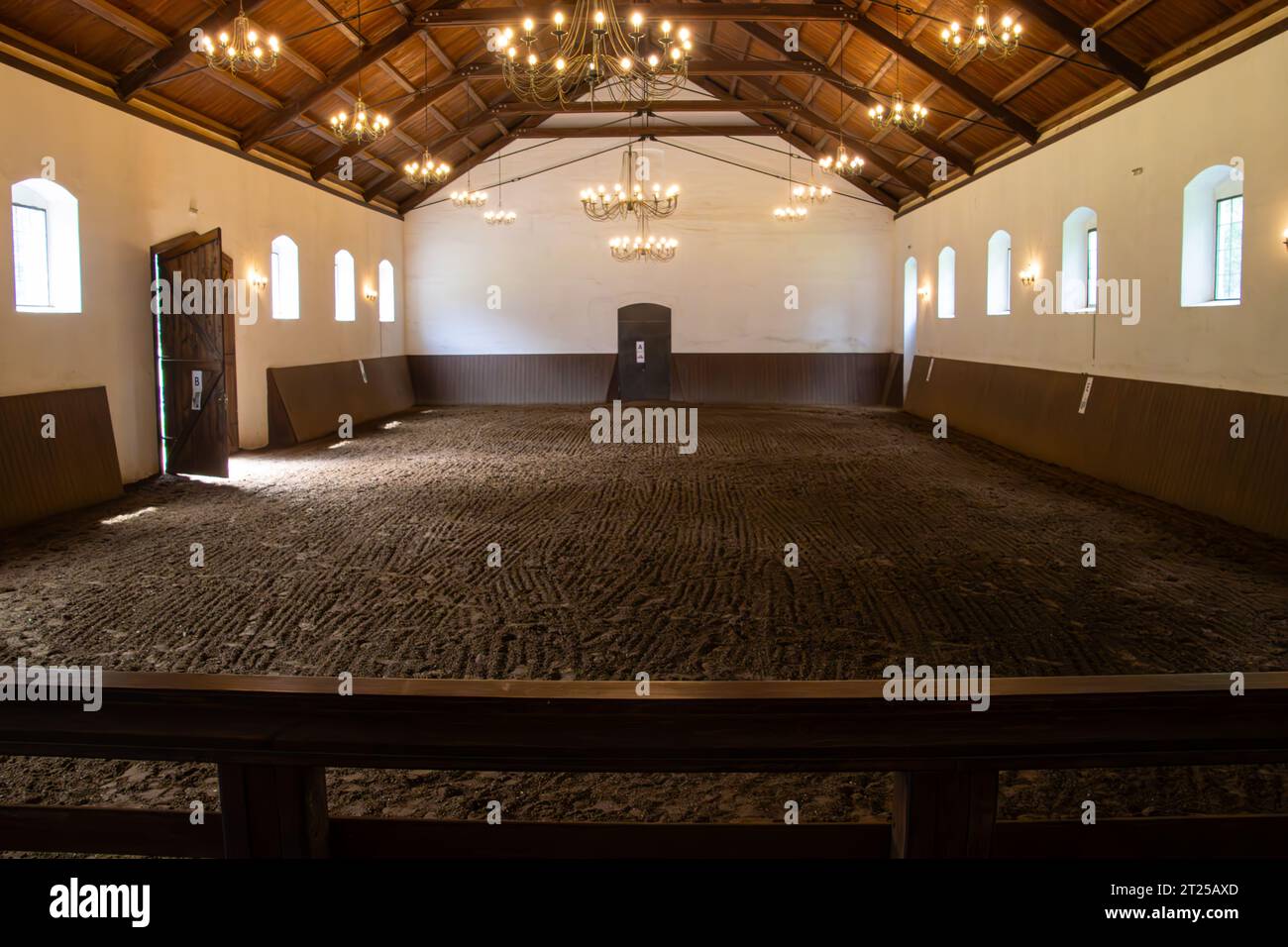 Indoor empty equestrian space. View in an indoor riding hall Stock Photo