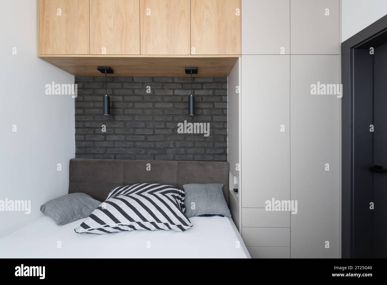 Small modern urban bedroom interior design Stock Photo - Alamy