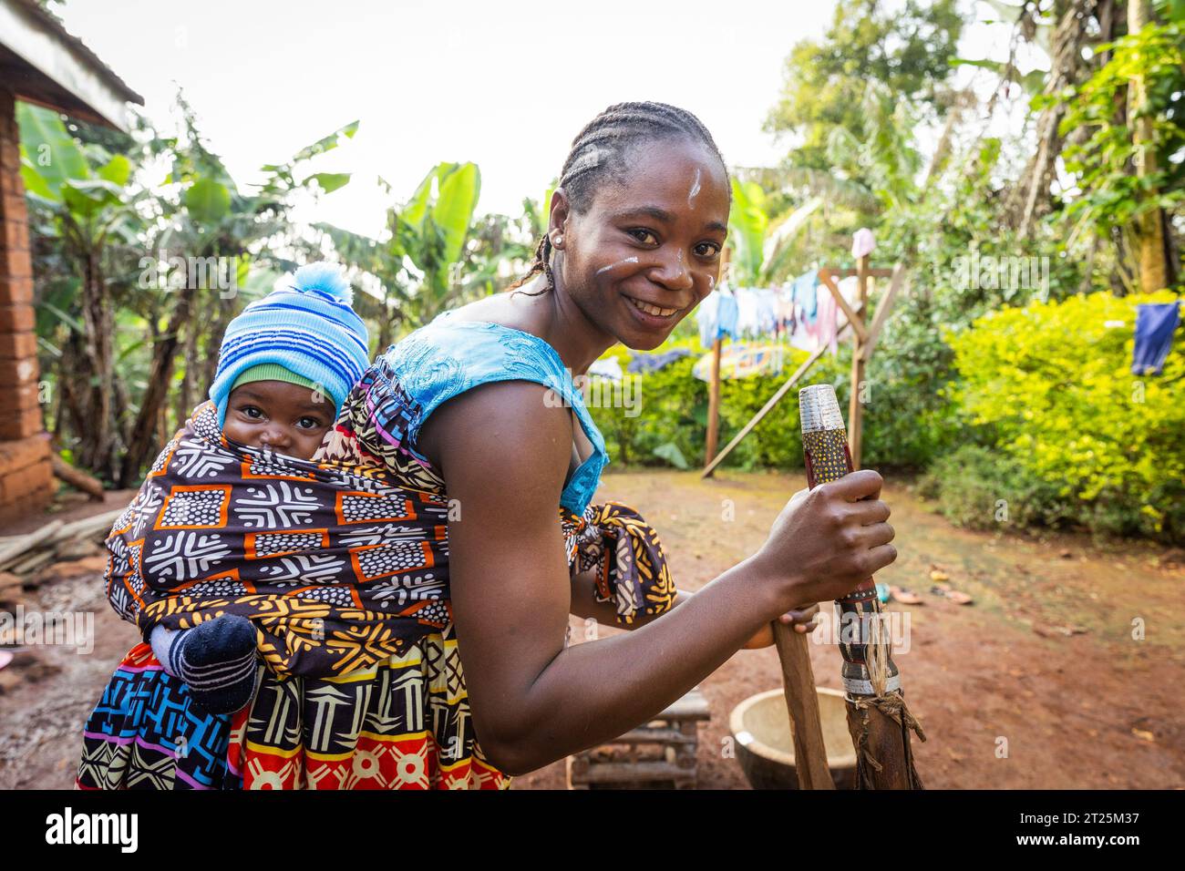 An African mother with her newborn son in the village, African tribal clothing Stock Photo