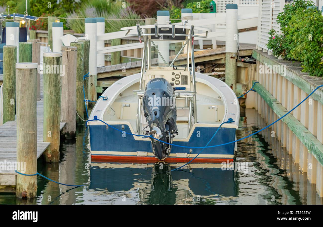 small outboard motor boat in a slip in sag harbor Stock Photo