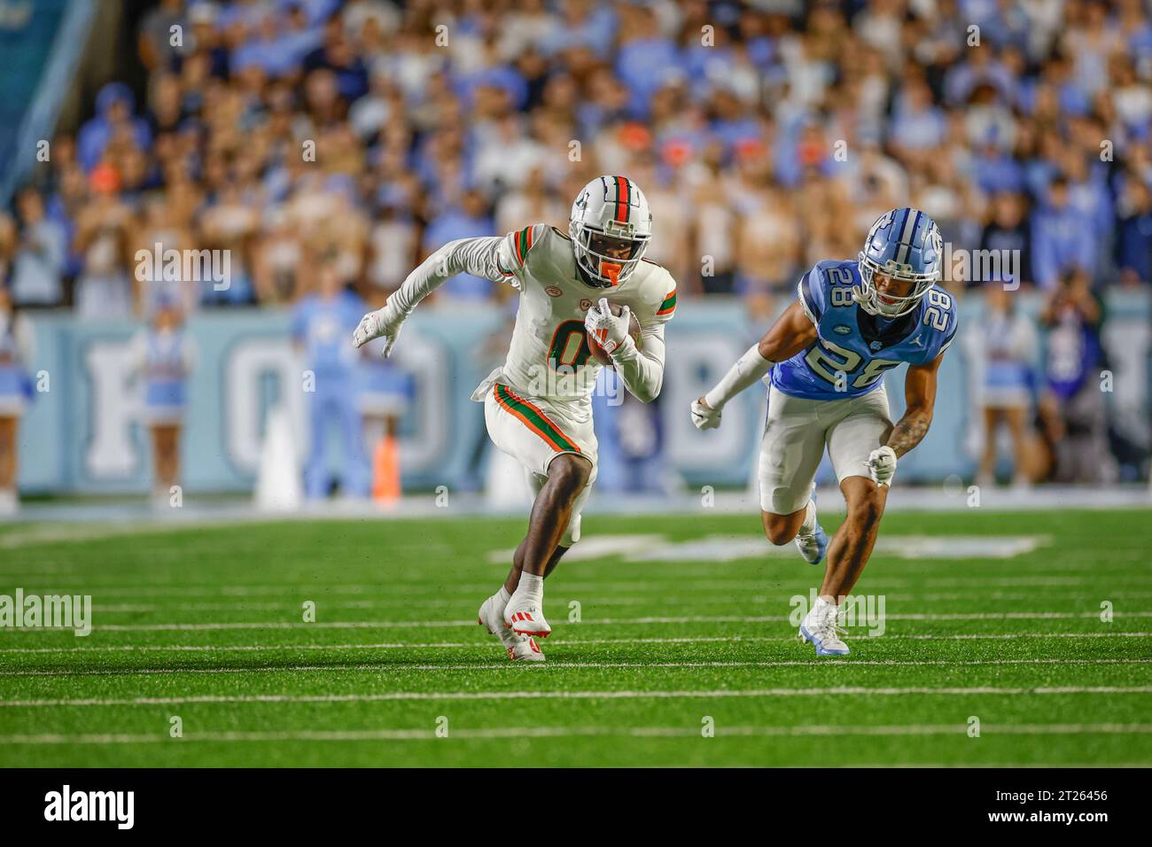 Chapel Hill, NC USA: Miami Hurricanes wide receiver Brashard Smith (0) runs with the ball while covered by North Carolina Tar Heels defensive back Ali Stock Photo