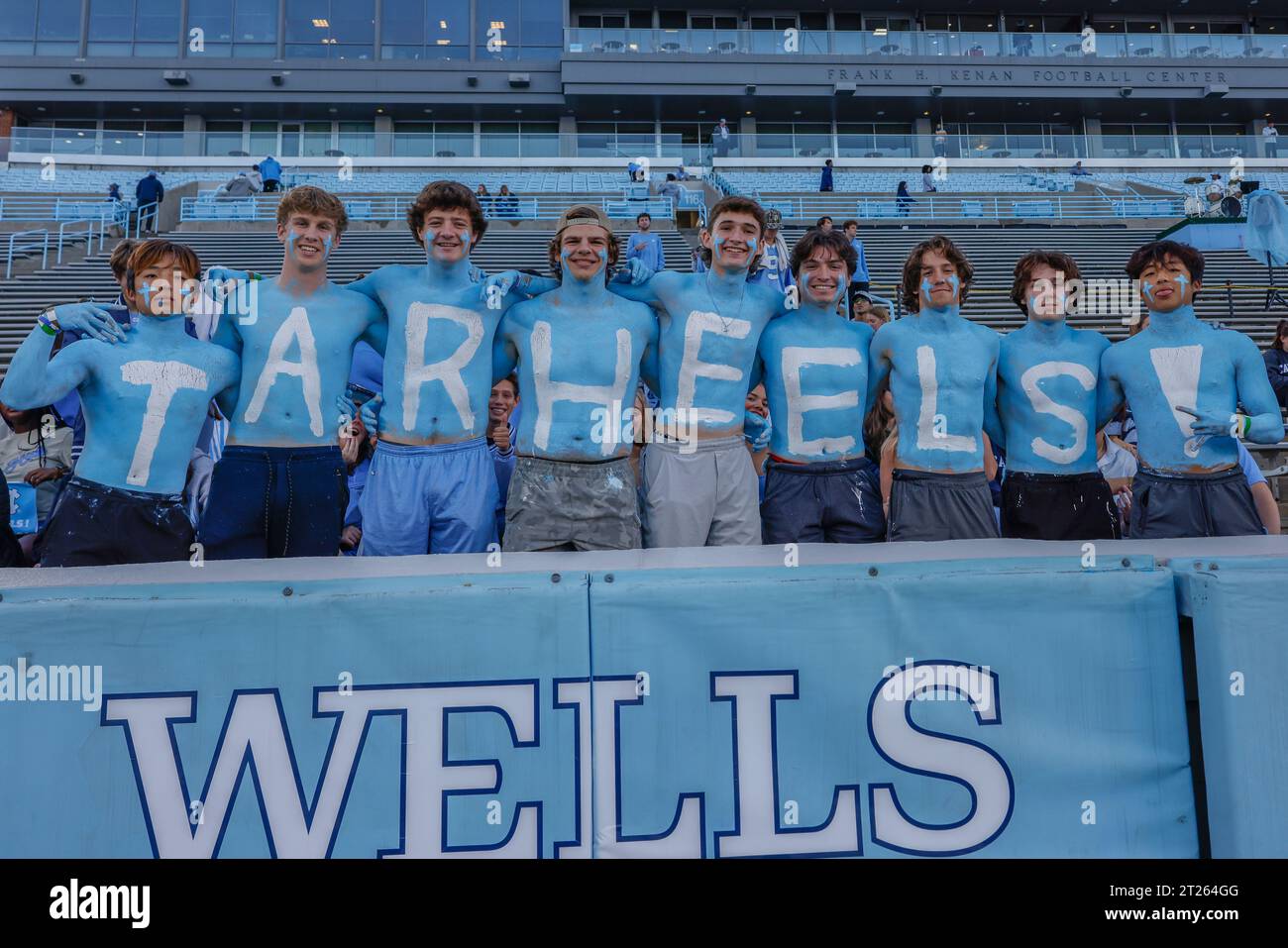 Chapel Hill, NC USA: North Carolina fans painted Tar Heels in blue and white to cheer for the team during an NCAA game against the Miami Hurricanes at Stock Photo