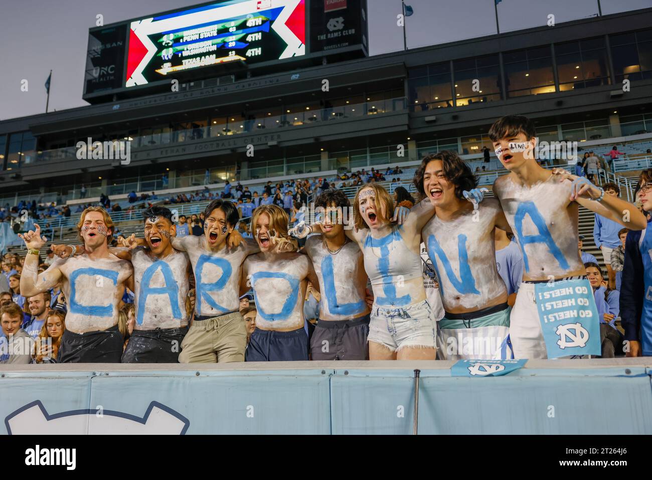 Chapel Hill, NC USA: North Carolina fans painted Carolina in blue and white to cheer for the team during an NCAA game against the Miami Hurricanes at Stock Photo