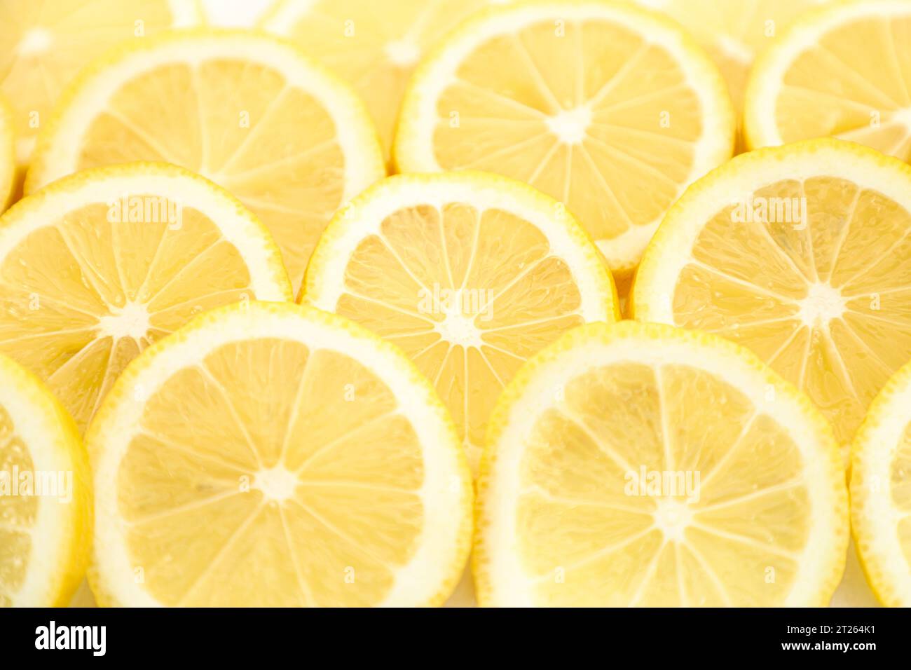 Juicy slices of lemon background Stock Photo