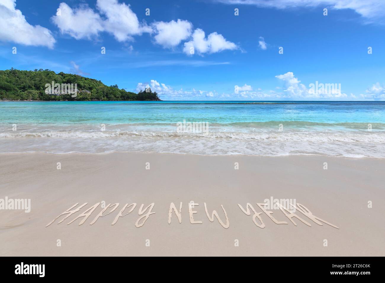 Happy New Year on tropical beach. Stock Photo