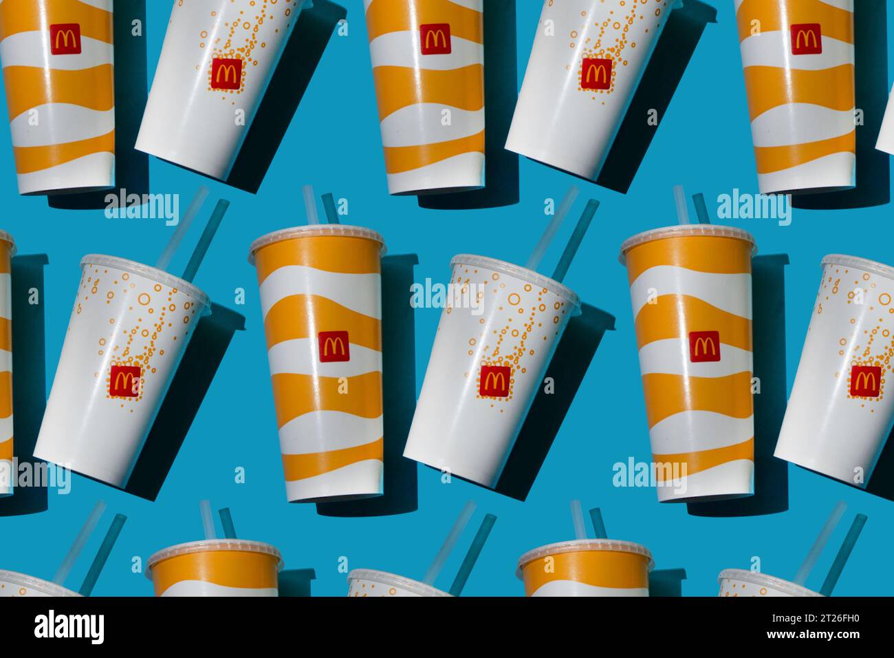 Yellow glass of McDonald's. Paper cup with lid. Takeaway drink ...