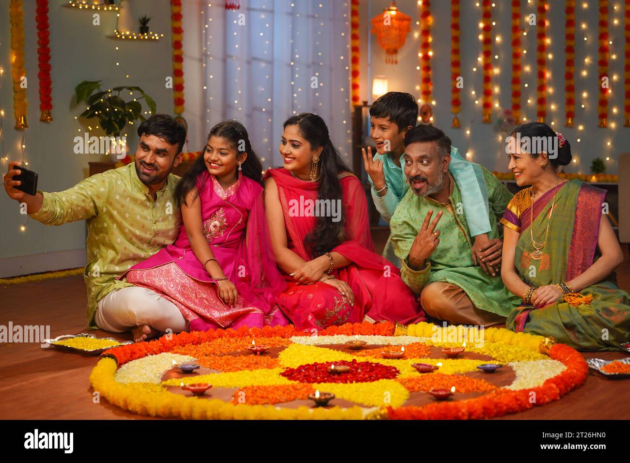 Group of Indian joint family members taking selife in front of ...