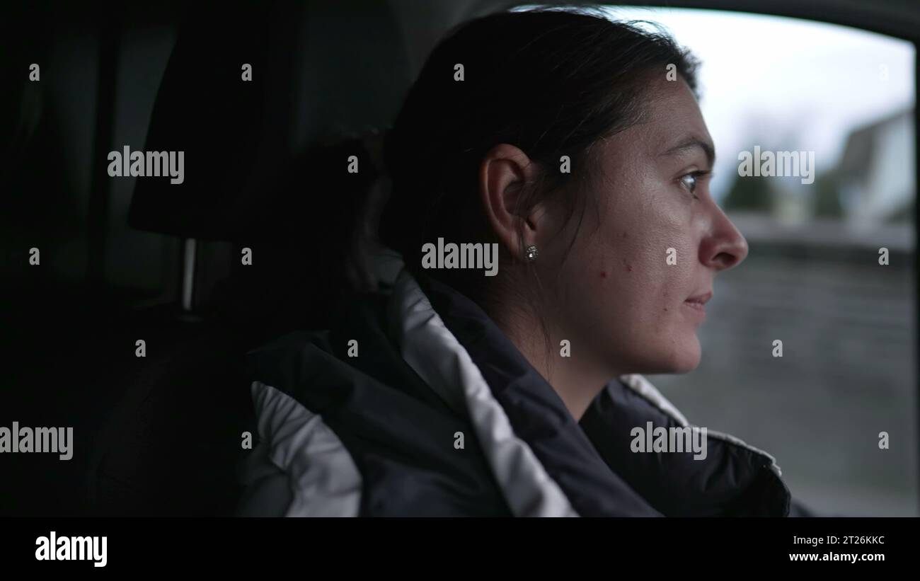 Determined Woman's Face Driving Truck on Highway, profile of driver