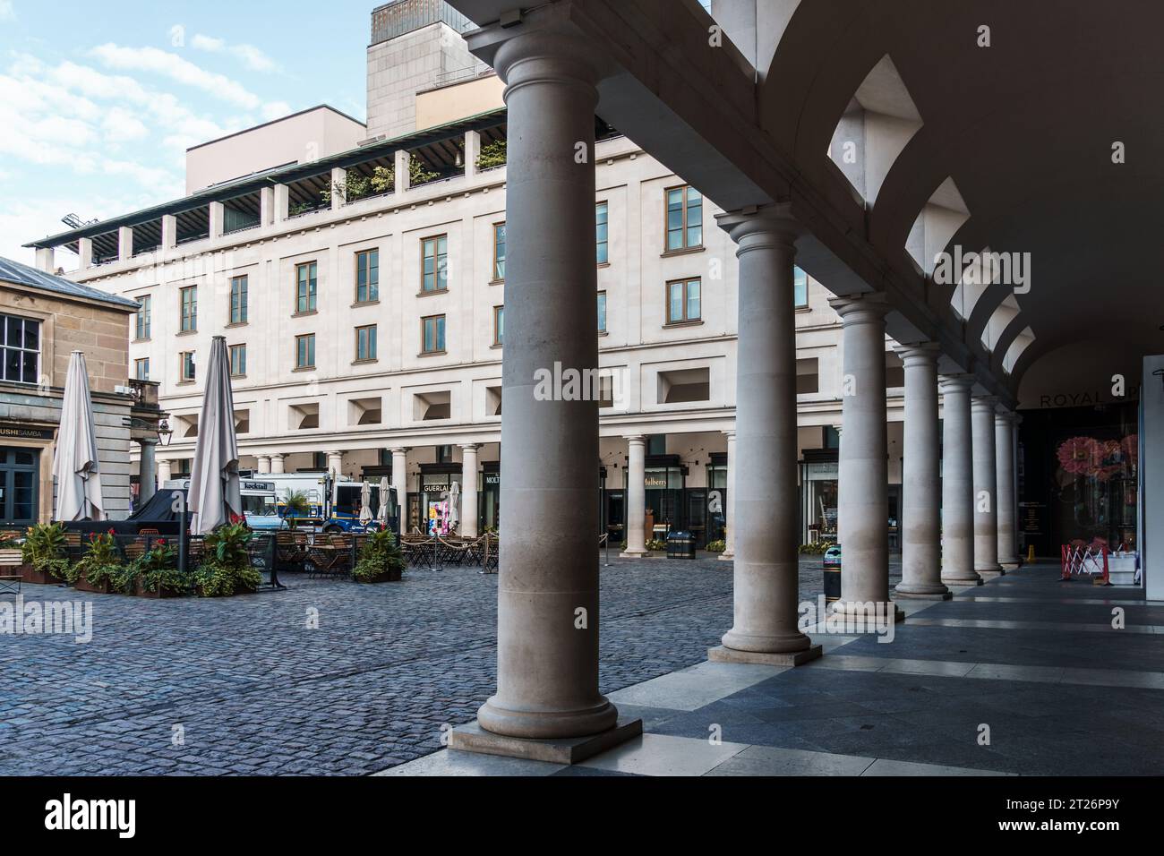 LONDON, UK - August 25, 2023: View of the arcade of Royal Opera House in Covent Garden area. Covent Garden is renowned for its luxury fashion and beau Stock Photo