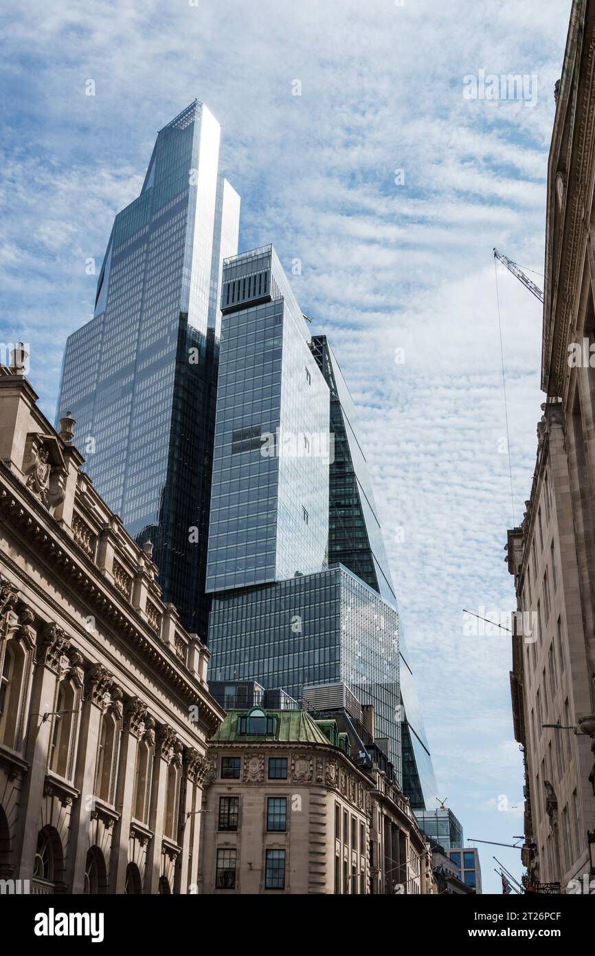 London, UK - August 25, 2023: Low angle view of modern and old office buildings in the City of London. Stock Photo