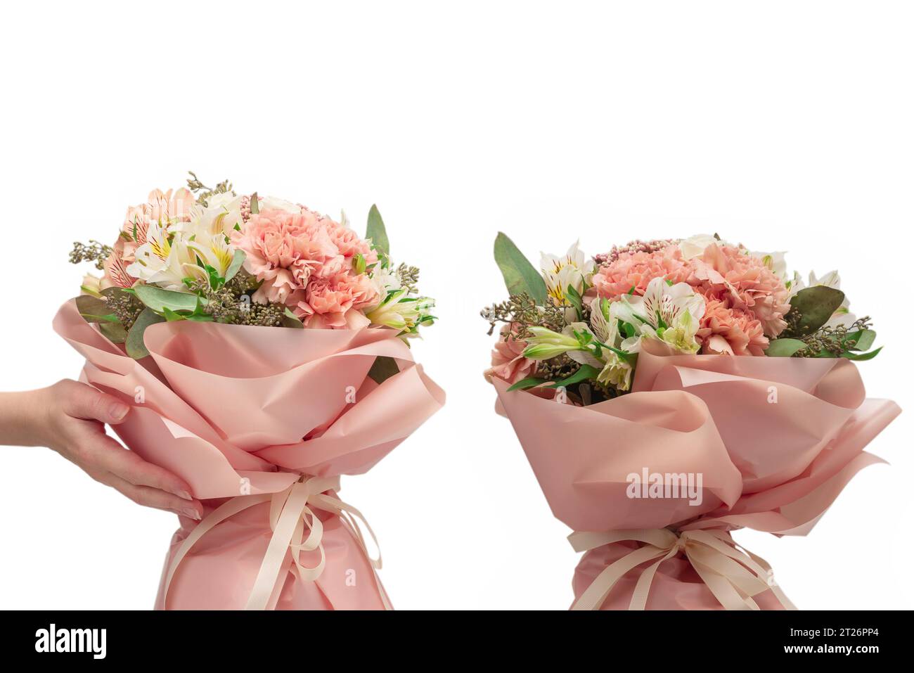 Premium Photo  Bouquet of soft pink flowers in pink wrapping paper in  woman hands isolated on white surface