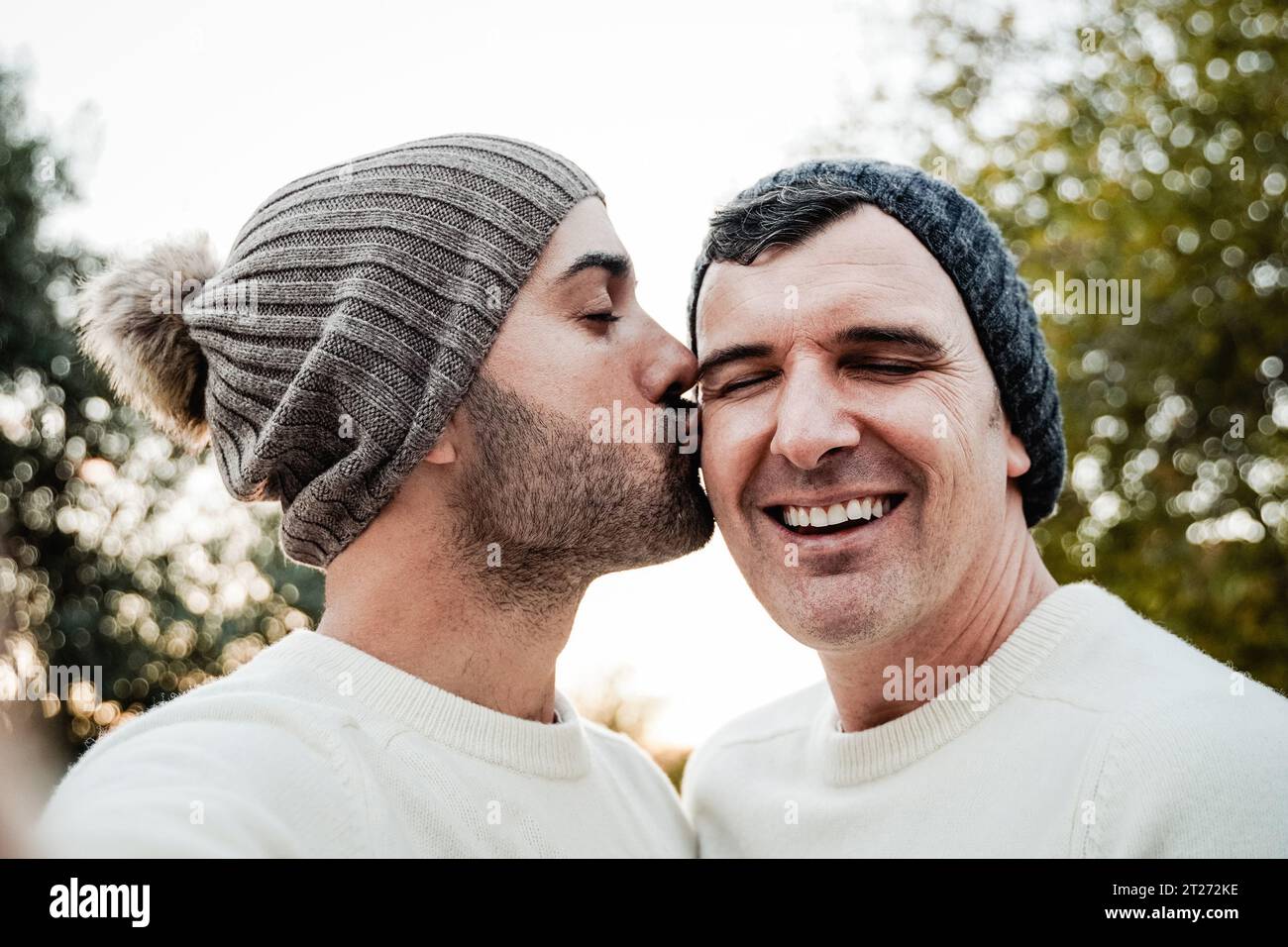 Mature Gay Couple Kissing Outside Male Lovers Taking Selfie Picture During Fall Or Winter Time