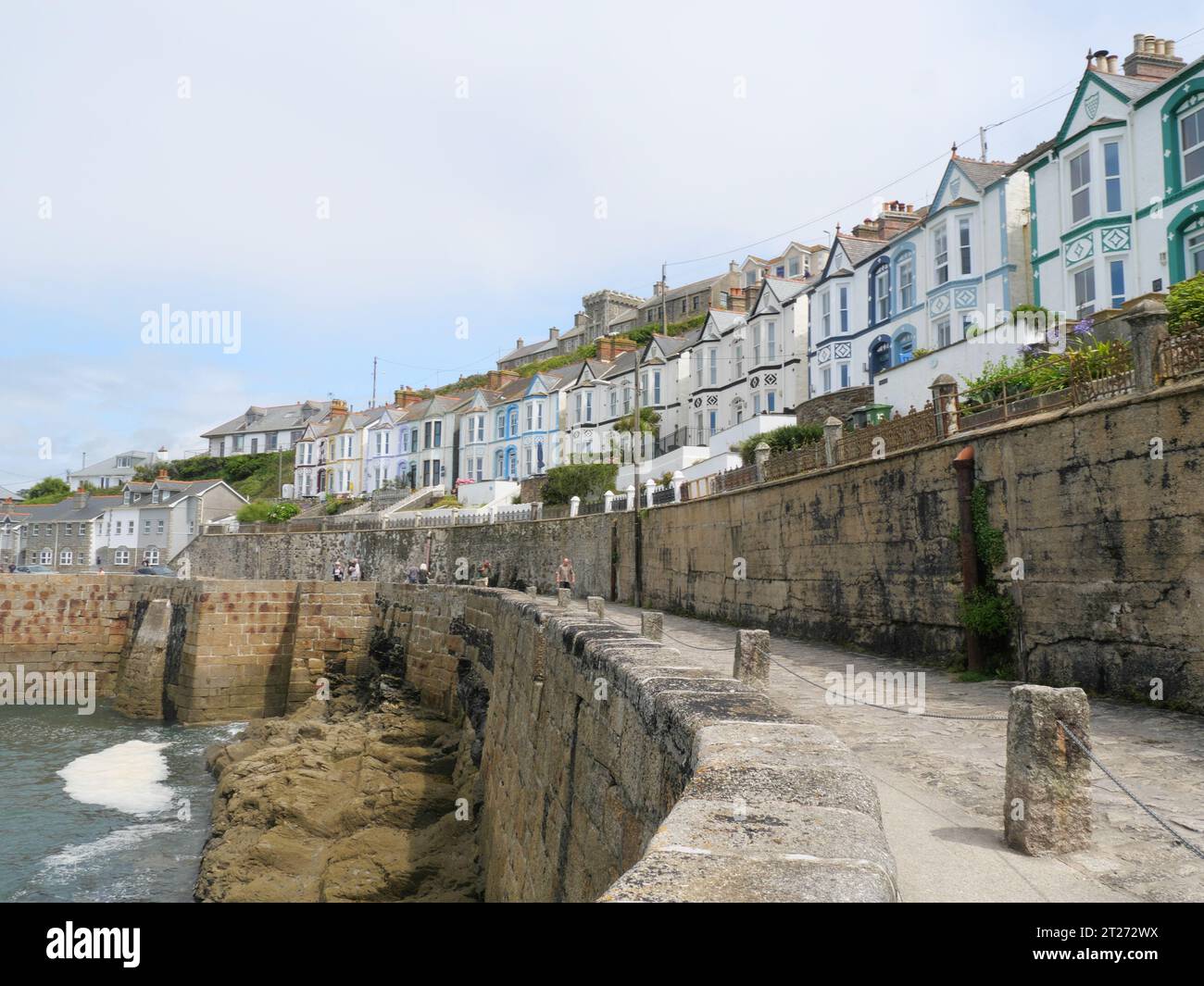 Typical english row house with bay windows above the harbour of