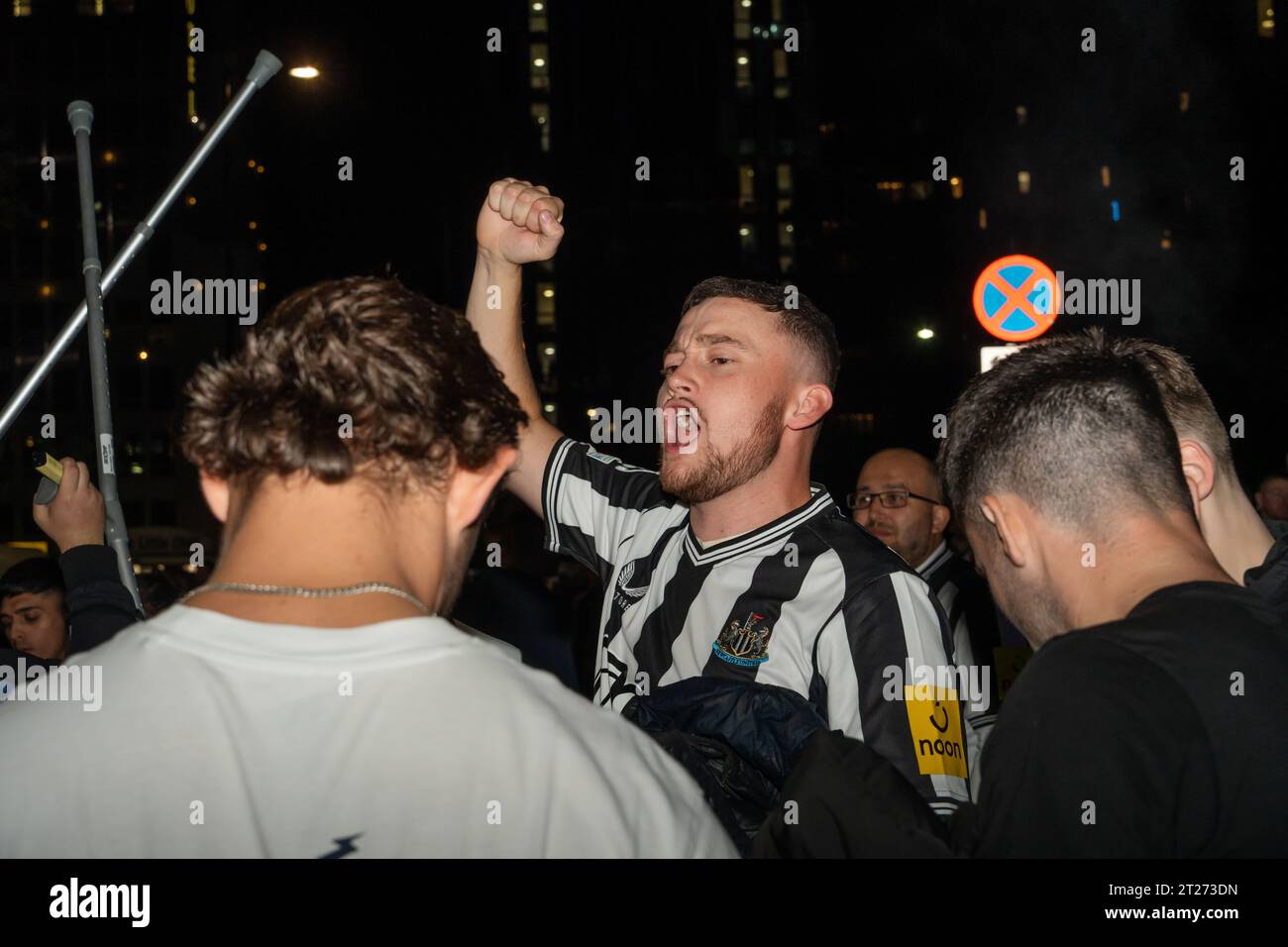 Newcastle United fans celebrate in the streets around St James' Park, after the team's 4-1 victory over PSG in Newcastle upon Tyne, UK Stock Photo