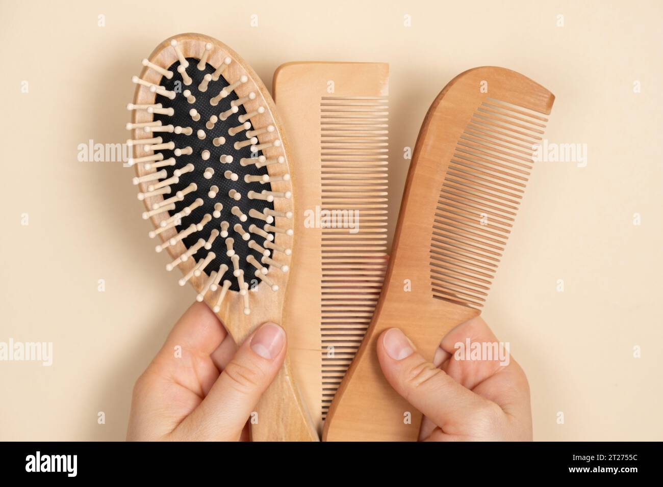 Wooden Combs In Woman's Hand, Natural Products In Hair Care Stock Photo