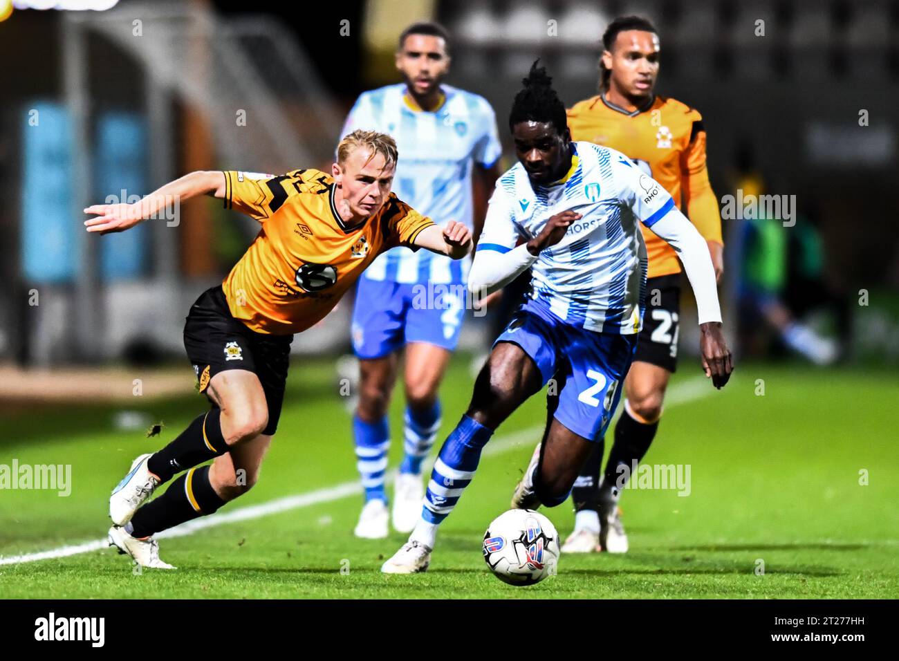 Liam Bennet (2 Cambridge United) and Jade Jay Mingi (20 Colchester United) battle for the ball during the EFL Trophy match between Cambridge United and Colchester United at the R Costings Abbey Stadium, Cambridge on Tuesday 17th October 2023. (Photo: Kevin Hodgson | MI News) Credit: MI News & Sport /Alamy Live News Stock Photo
