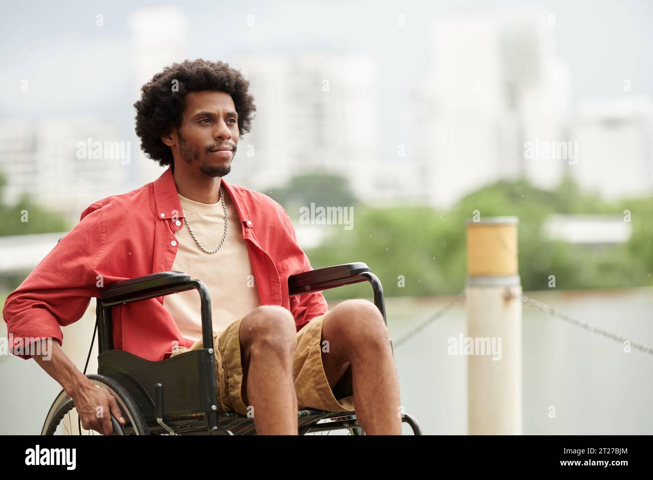 Pensive black man sitting hi-res stock photography and images - Alamy